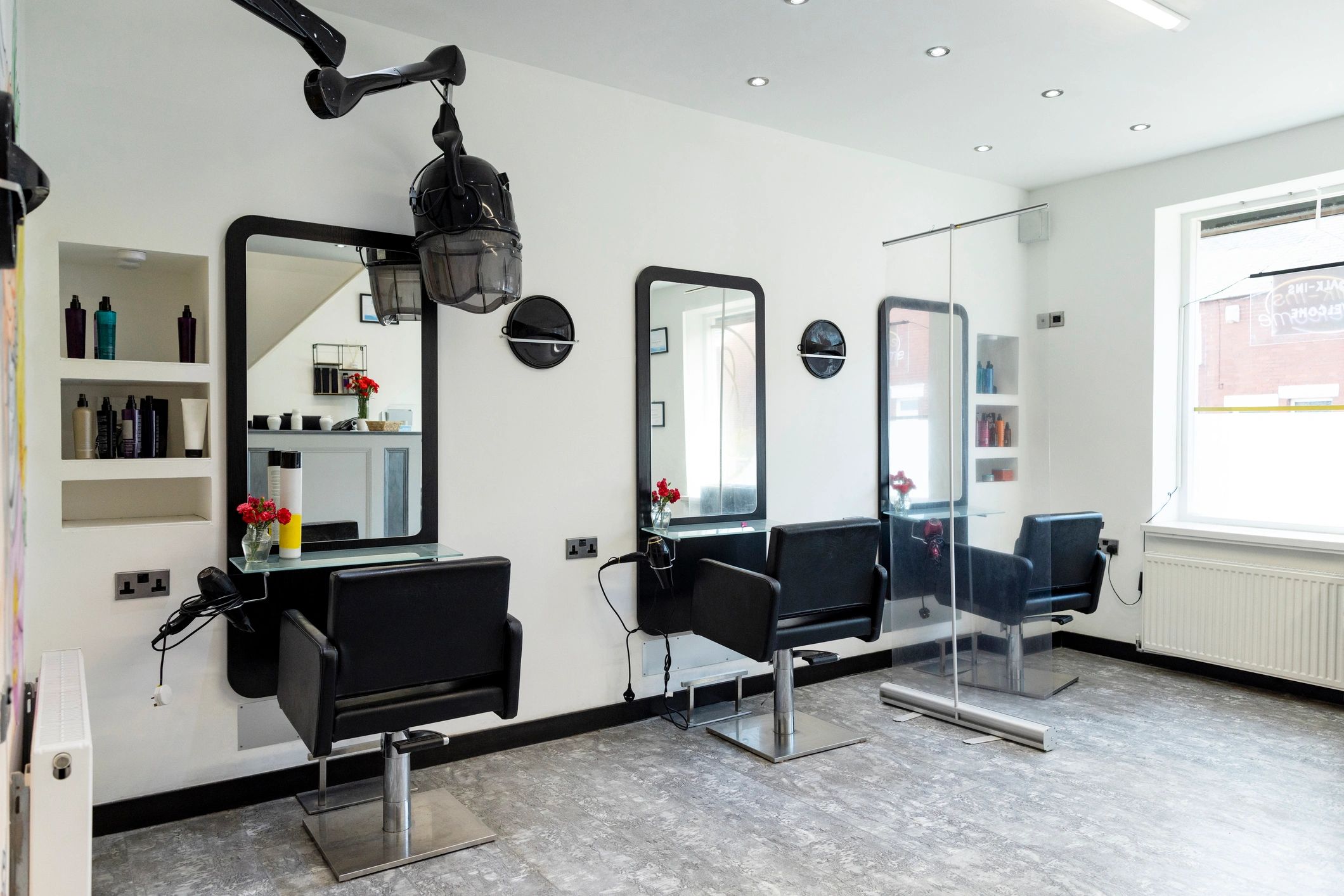 Salon interior with styling stations and chairs